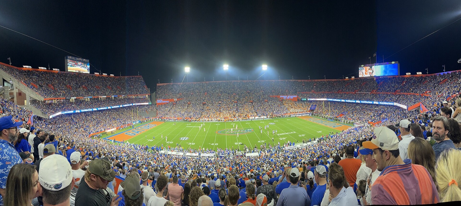 A packed Ben Hill Griffin Stadium under the lights before a Florida game