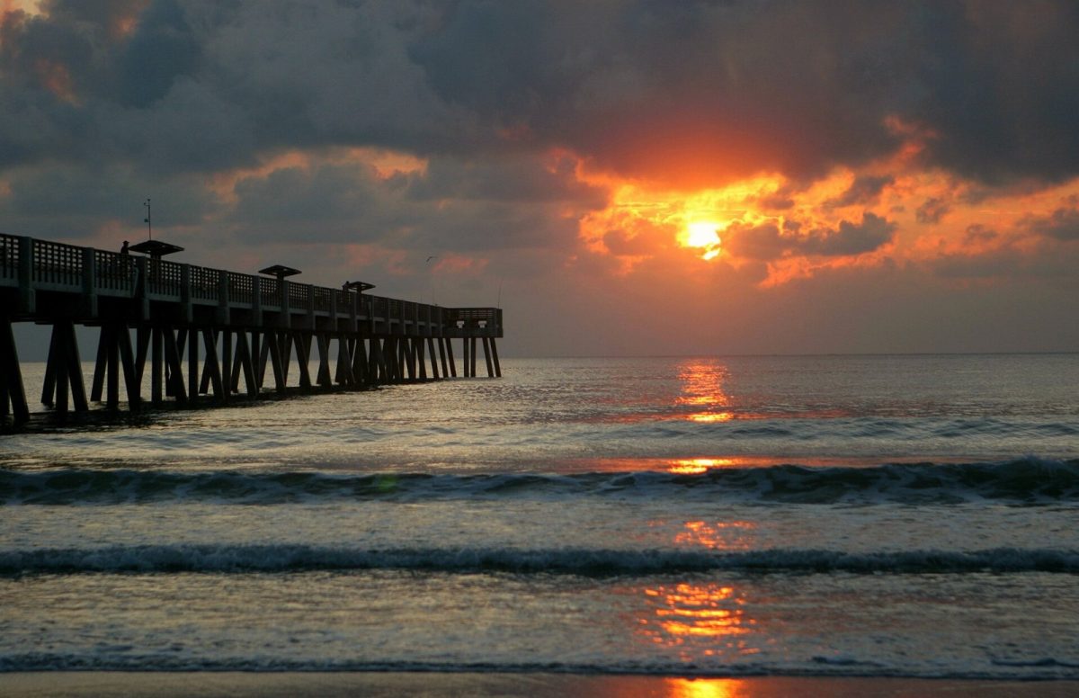 The sun rises beside the Jacksonville Beach Pier in 2007.