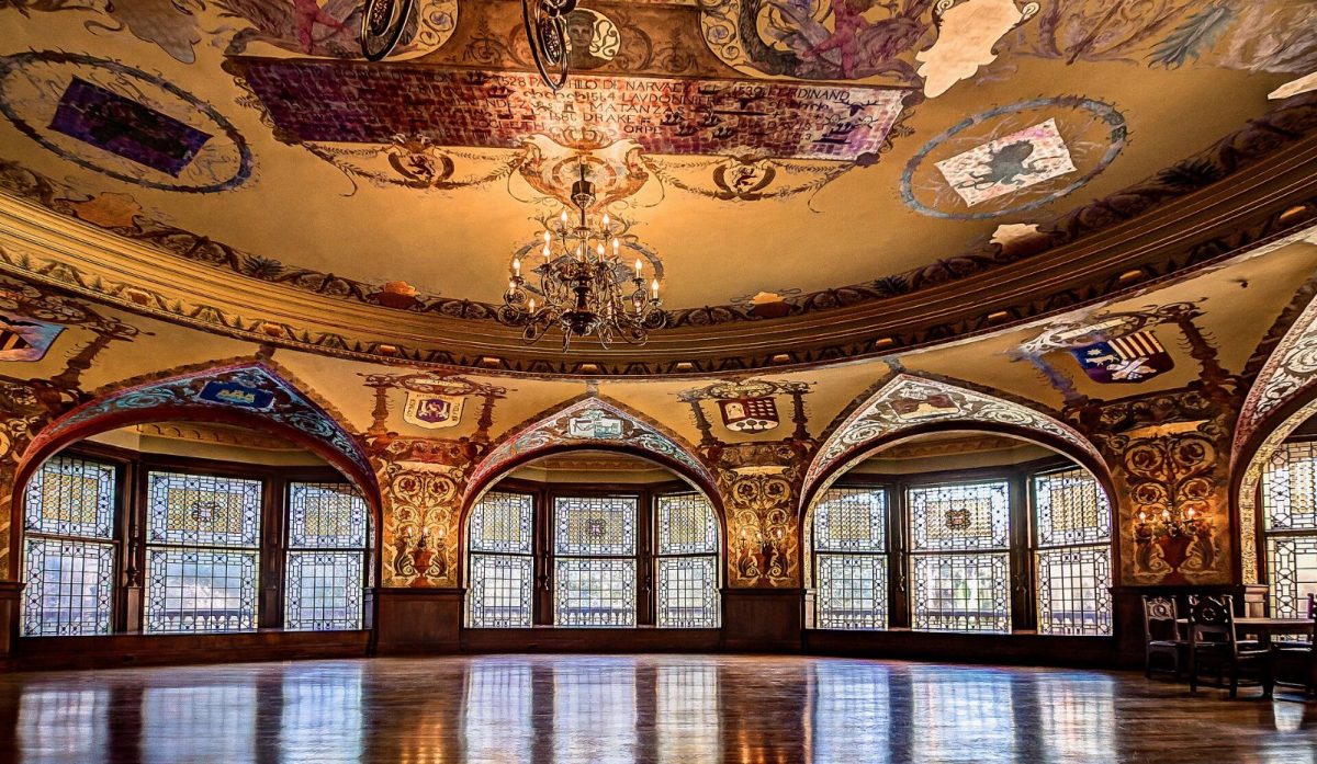 Flagler College's dining hall, lit by Louis Comfort Tiffany's stained glass windows.