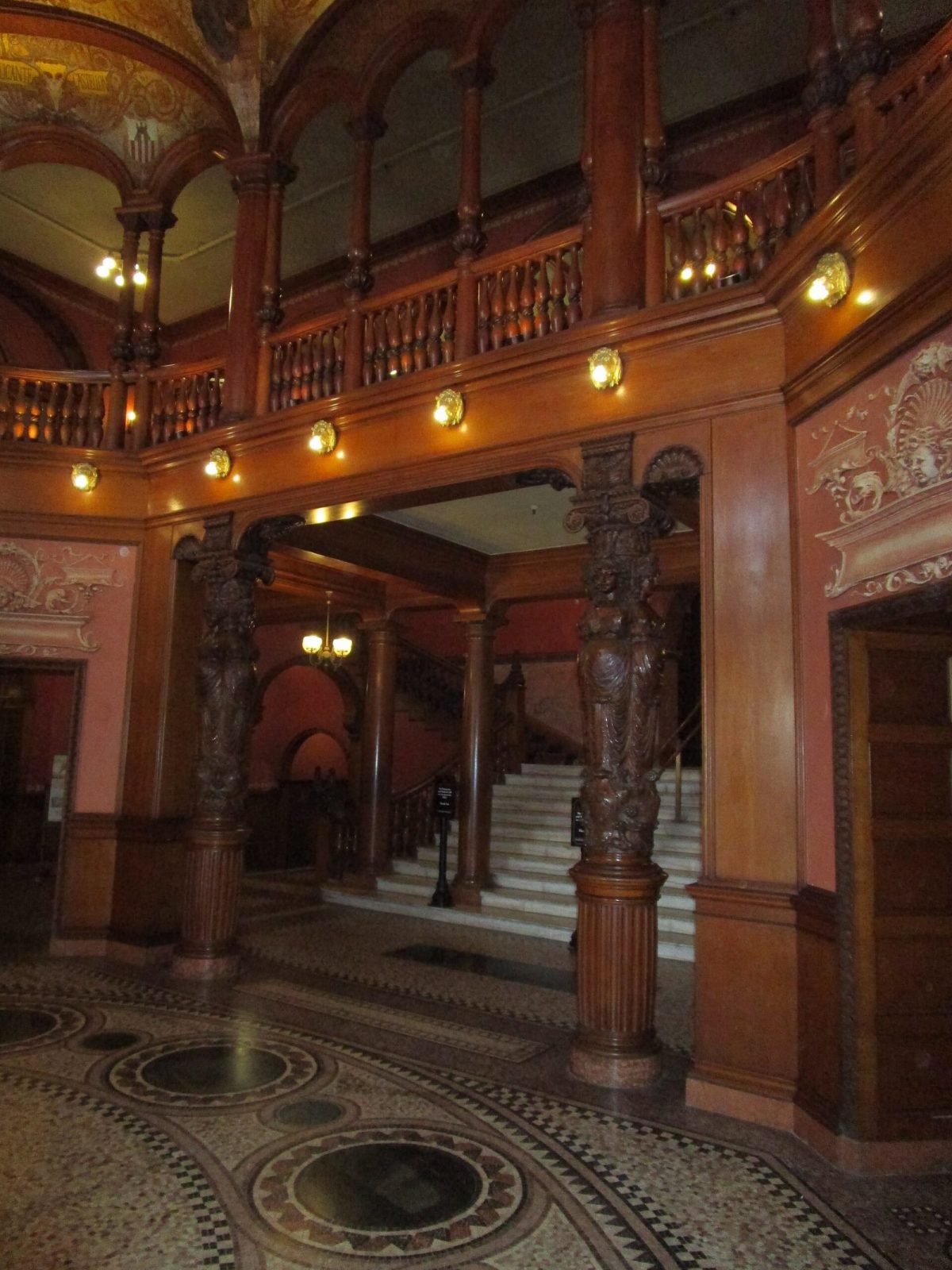 Carved oak caryatid columns in the lobby rotunda of Flagler College.