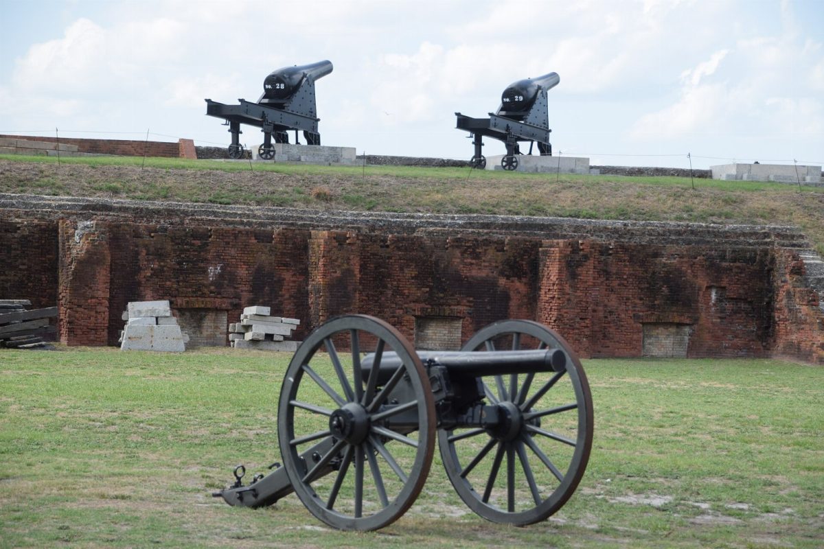 Cannons on the ramparts and a field gun on the parade ground at Fort Clinch.