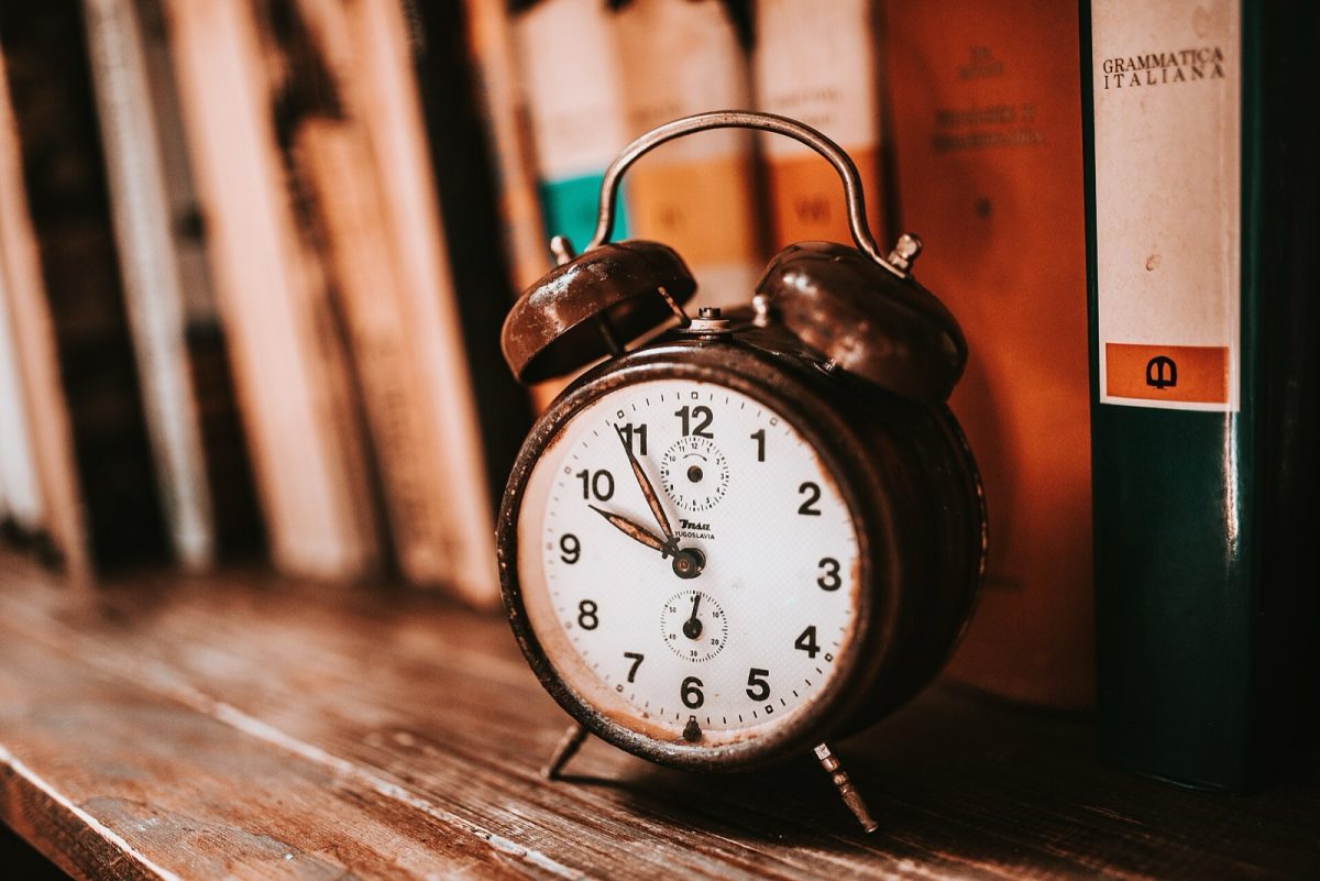 An old alarm clock on a bookshelf (file photo).