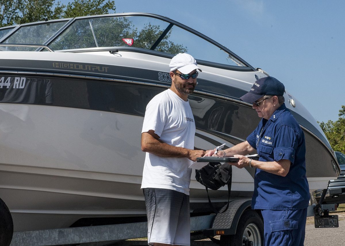A Coast Guard Auxiliary member conducts a free vessel safety check at a Florida boat ramp (file photo).