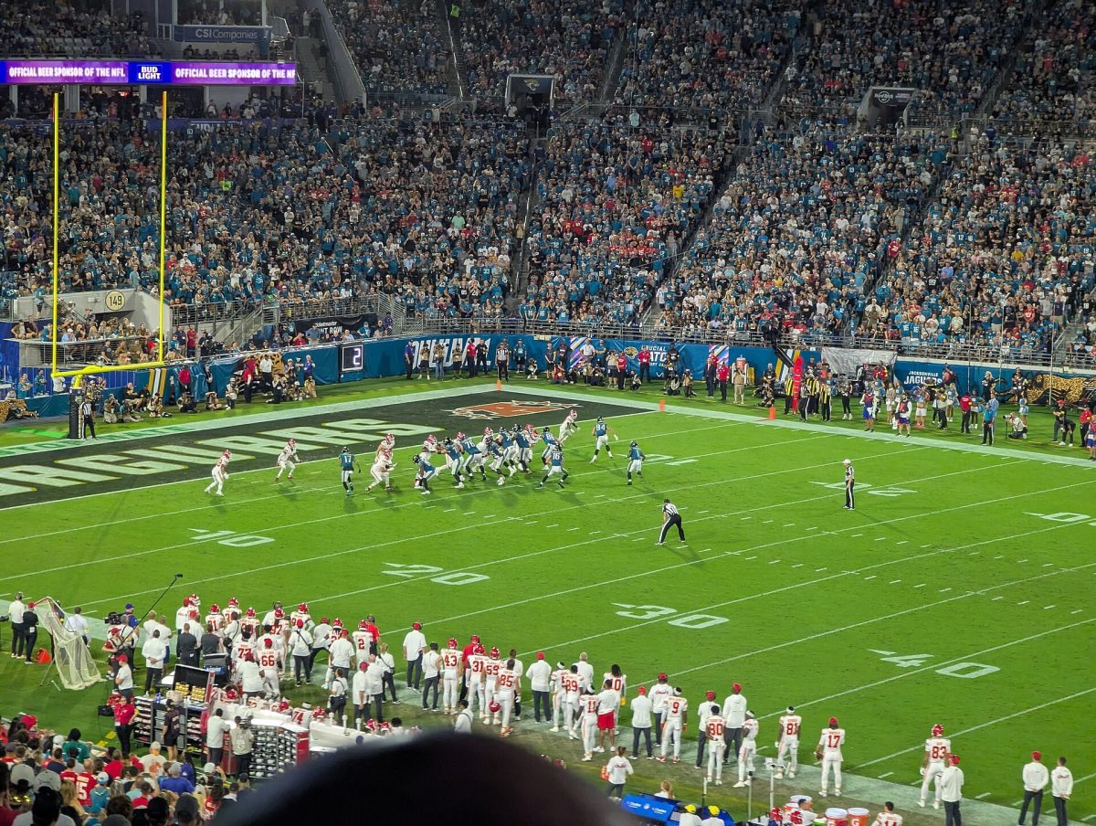 Travis Etienne runs against the Kansas City Chiefs at EverBank Stadium in October 2025.